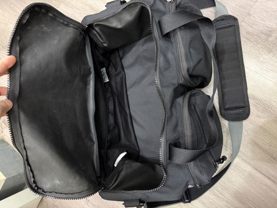 Nike Black Gym Duffel Bag with Multiple Pockets (Category: Backpacks) located in Manila. Submitted by gmfhardware (Listing ID 1468930917, Image 3). Description: - Authentic Black Nike Duffel Bag - Rugged, durable material with heavy-duty zippers - Multiple exterior zipped pockets for easy organization - Large main compartment featuring mesh interior dividers - Comfortable padded shoulder strap and dual carry handles - Ideal for gym sessions, spor