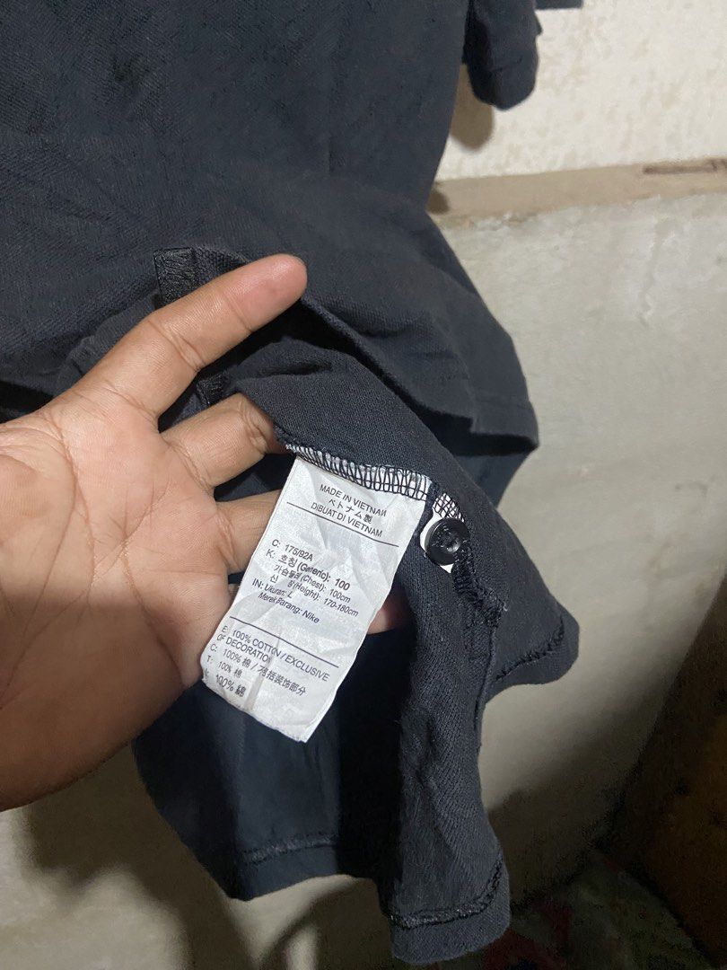 Nike Black Polo Shirt (Category: Tshirts & Polo Shirts ) located in Cagayan de Oro. Submitted by mindanao_thrifters (Listing ID 1468944620, Image 3). Description: - Brand: Nike - Item: Classic Polo Shirt - Color: Black with white embroidered chest logo - Size: Large (fits true to size) - Material: 100% Cotton (Made in Vietnam) - Condition: Good pre-loved/casual piece - Styling: Easy to match with jeans or shorts for everyday wear.