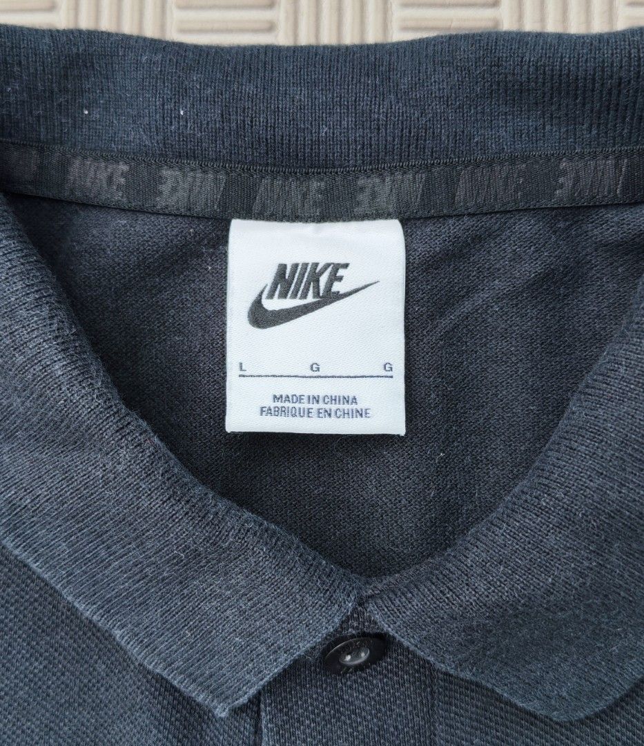 Nike Black Polo Shirt Size L (Category: Tshirts & Polo Shirts ) located in Santa Rosa. Submitted by big.hanger.apparel (Listing ID 1469081302, Image 3). Description: Brand: Nike Gender: Unisex Tag Size: L Actual Measurement: 28" Length × 20" Width Fit: Regular Fit / can fit Medium to Large depending on preferred fit Condition: Very Good — 8/10 Color: Black / Dark Charcoal Design: Classic Nike Swoosh Logo Polo Shirt with collared neckline Material