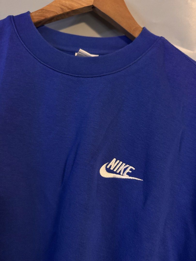 Nike Blue Crewneck Sweatshirt Size M (Category: Coats, Jackets and Outerwear) located in Alaminos. Submitted by outfitcheck.ph (Listing ID 1469101346, Image 2). Description: - Brand: Nike - Style/Color: Bold Blue Crewneck with White Embroidered Swoosh (Style Code: BV2662-480) - Size: Medium - Material: Comfortable inner fleece with ribbed collar, cuffs, and hem - Origin: Made in Pakistan - Condition: Excellent, ready to wear.