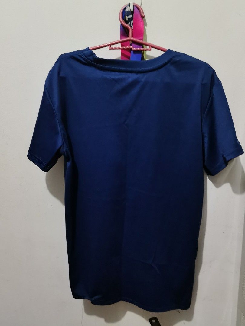 Nike Blue Just Do It T-Shirt (Category: Tshirts & Polo Shirts ) located in Valenzuela. Submitted by paaaatt (Listing ID 1469017069, Image 3). Description: Dark blue Nike t-shirt with short sleeves and a crew neck. Front graphic features a purple and pink camo swoosh above white text saying JUST DO IT. Back is plain solid dark blue. Soft athletic fabric..