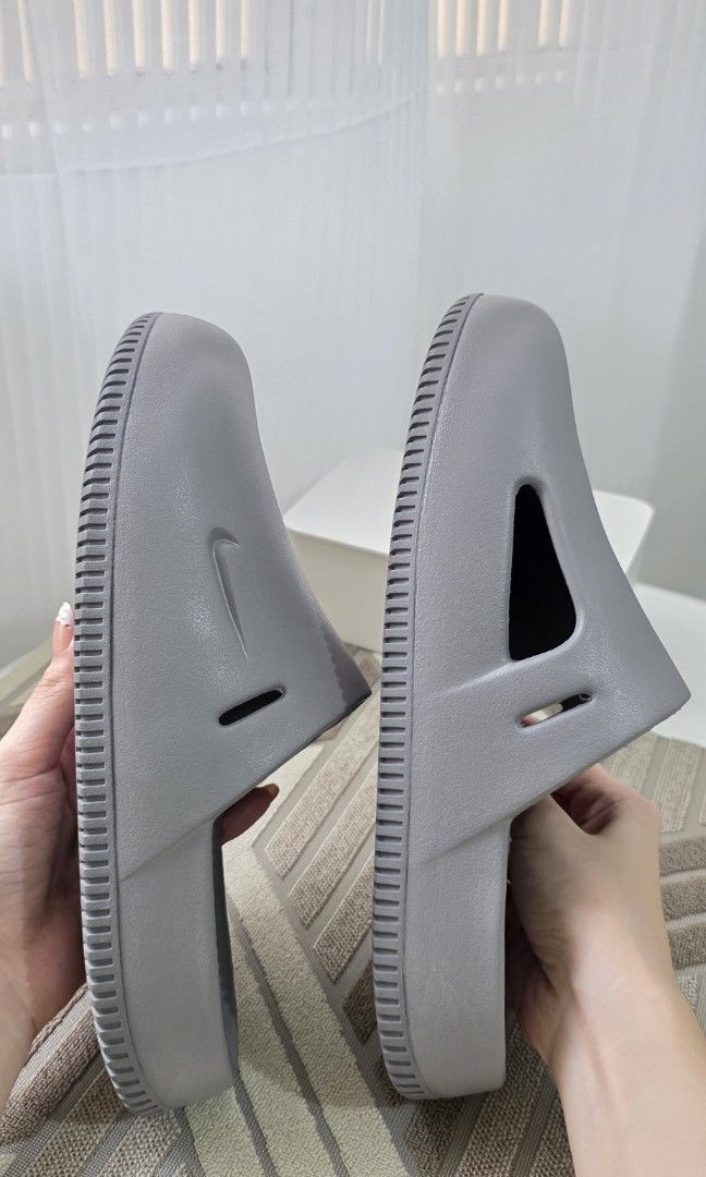 Nike Calm Mules (Category: Slippers & Slides) located in Malabon City. Submitted by j.a.rubio (Listing ID 1469051479, Image 3). Description: Nike Calm Mules with Strap Flat Pewter size 9M/10W original price Php3,695 like new, used twice only (indoor) with box & strap rfs. not using it anymore Php 999.