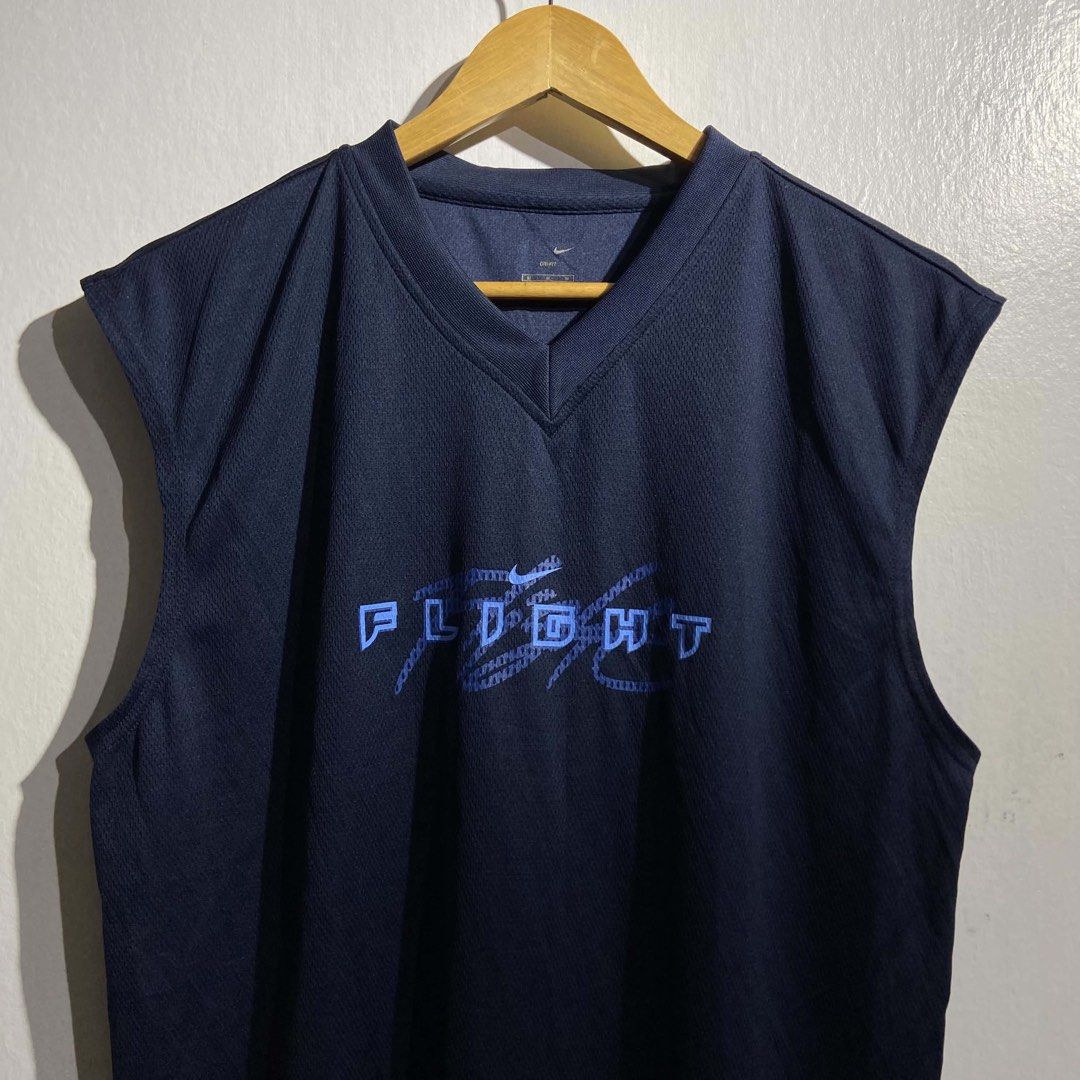 Nike Flight Blue Text Mesh Tank Top (Category: Activewear) located in Roxas City. Submitted by vaultcultureco. (Listing ID 1469092981, Image 2). Description: - Brand: Nike - Style: Sleeveless basketball tank top / V-neck - Color: Navy blue with light blue 'FLIGHT' graphic and Nike swoosh - Material: 100% breathable polyester mesh - Size: Tagged 95 / Medium - Origin: Made in China - Condition: Excellent, ready to wear.