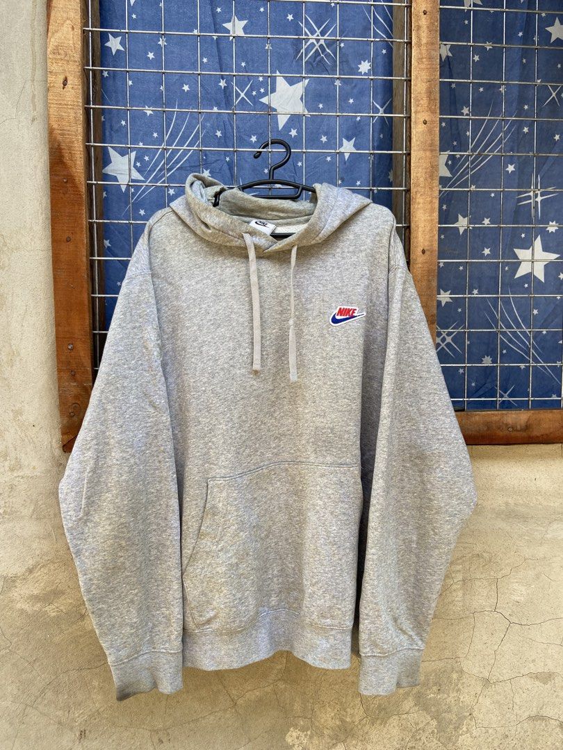 Nike Gray Hoodie with Big Back Logo (Category: Hoodies) located in Cagayan de Oro. Submitted by mindanao_thrifters (Listing ID 1468944279, Image 1). Description: - Authentic gray Nike hoodie with comfortable fleece lining inside - Features a small retro embroidered Nike patch on the left chest - Eye-catching large orange Nike Sportswear text and swoosh printed on the back - Drawstring hood, front kangaroo pocket, and ribbed cuffs and hem - Standa