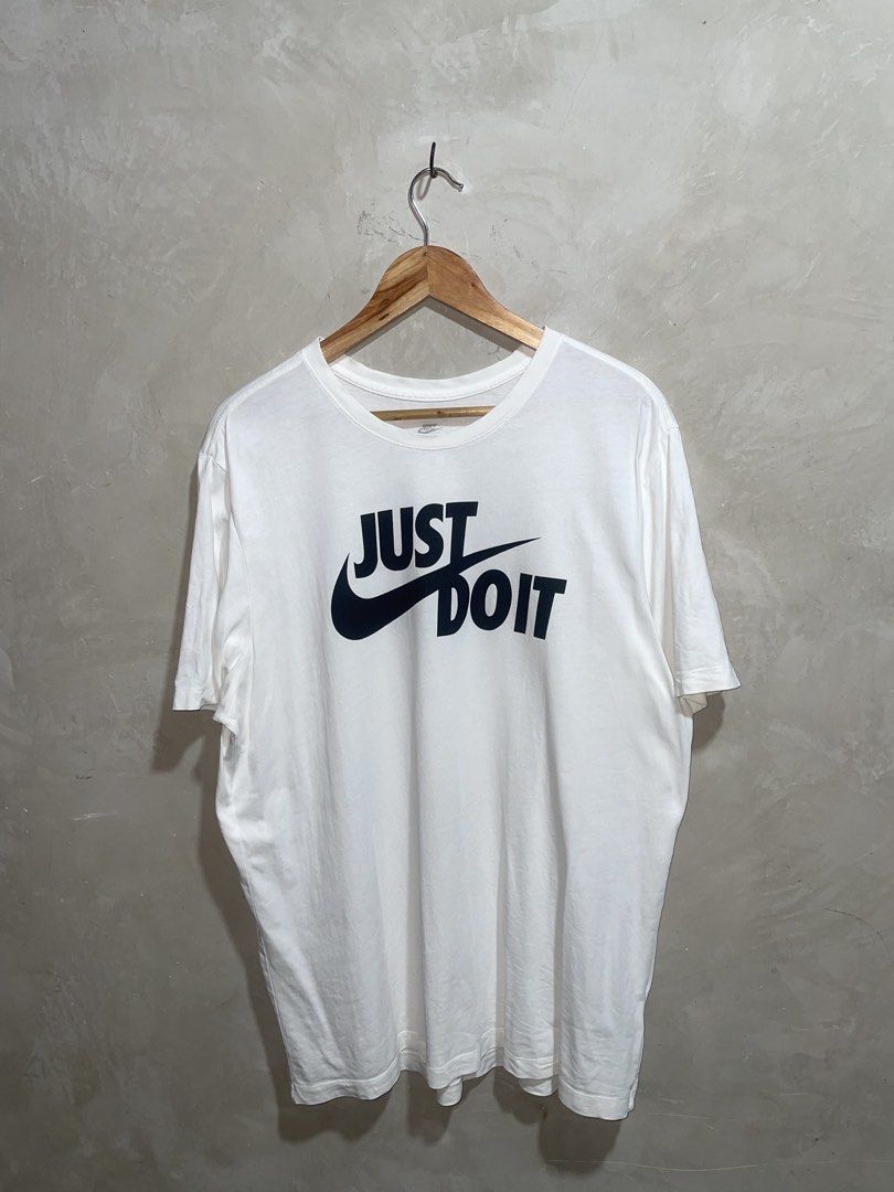 Nike Just Do It White T-Shirt (Category: Shirts) located in Molave. Submitted by thriftedstore.horse (Listing ID 1469101844, Image 1). Description: Condition- excellent Issue- hairline Color rate- 9.8/10.