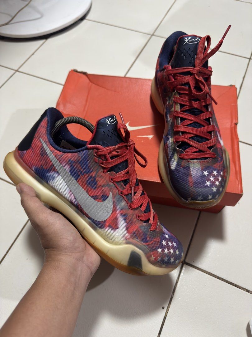 Nike Kobe 10 Independence Day (Category: Sneakers) located in Manila. Submitted by mislangers_stuff (Listing ID 1469052661, Image 1). Description: - Brand/Model: Nike Kobe X USA - Size: US 8.5 / EUR 42 - Design: Patriotic flag graphic with stars and red accents - Sole: Translucent yellow rubber with iconic gold X logo - Condition: Light wear on outsole tread - Inclusion: Comes with original orange box - Ideal for: Basketball players and sneaker c