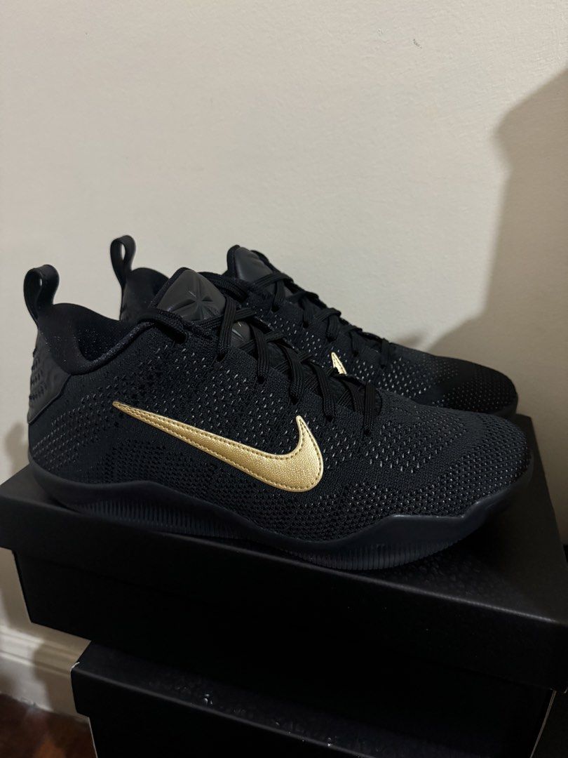 Nike Kobe 11 FTB Size 10.5 (used twice) (Category: Sneakers) located in Pasig City. Submitted by jzm24 (Listing ID 1468983464, Image 2). Description: - Model: Nike Kobe Basketball Shoes - Colorway: Black with Gold Swoosh - Upper: Lightweight and breathable Flyknit construction - Outsole: Textured rubber for maximum grip and traction - Branding: Signature Kobe logo on the tongue - Condition: Great overall condition, soles show almost no wear - Inc