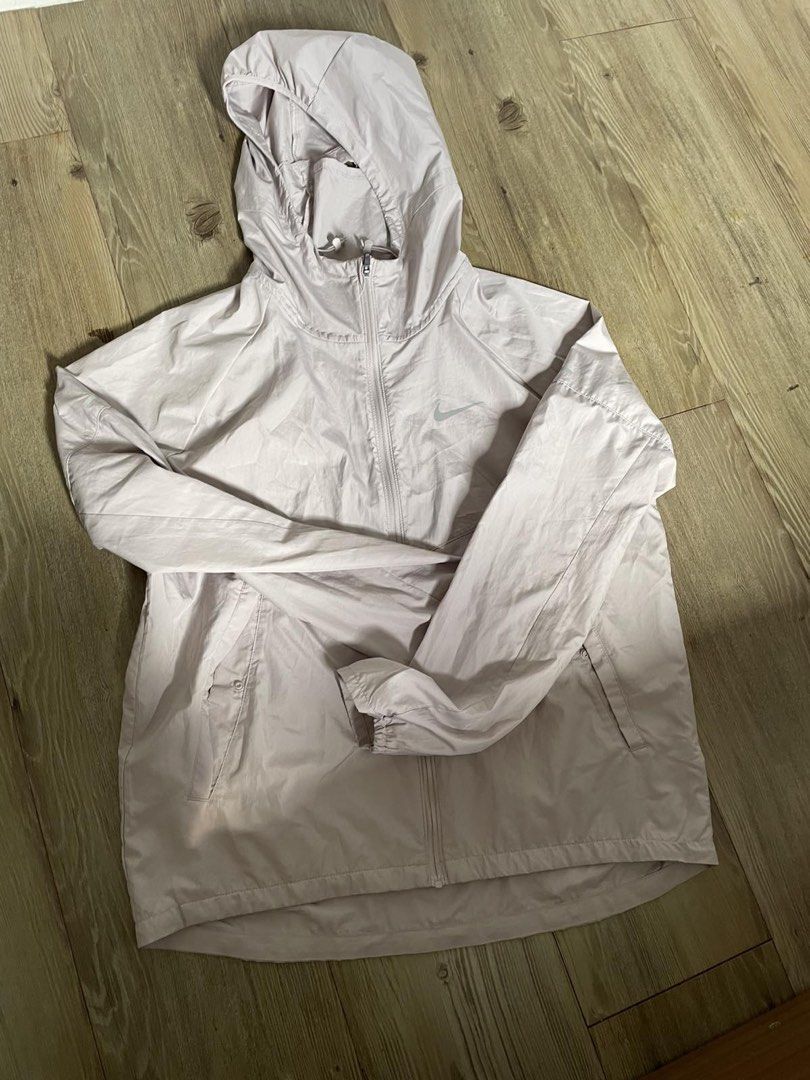 Nike Light Pink Windbreaker Jacket with Hood (Category: Coats, Jackets and Outerwear) located in Manila. Submitted by puredeer-f1ce (Listing ID 1468960125, Image 1). Description: ( Legit from Store 100% ) Not Fake or Class A Size small Used Once almost brandnew Meet up or Lalamove Alabang area.