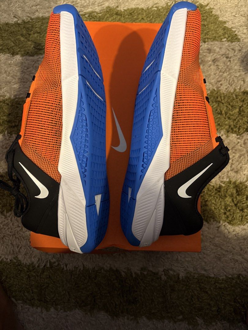 Nike Metcon 10 Training Shoes Orange Blue (Category: Sneakers) located in Pasig City. Submitted by ripescobar (Listing ID 1469016675, Image 3). Description: - Brand: Nike - Type: Training shoes - Color: Bright orange mesh upper with black accents and white swoosh - Soles: Blue and white rubber soles for maximum grip during lifts and workouts - Laces: Black - Inclusion: Original orange Nike shoebox included - Condition: Brand New.