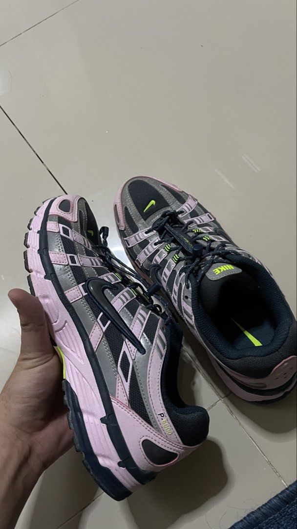 Nike P-6000 Pink Black Grey Sneakers (Category: Sneakers) located in Calamba. Submitted by jonny.1598 (Listing ID 1468974793, Image 3). Description: - Model: Nike P-6000 - Colorway: Pink, black, and grey with striking volt green accents - Closure: Unique bungee lacing setup with toggles - Materials: Breathable mesh base with stylish metallic overlays - Sole: Chunky sole with durable rubber waffle traction - Details: P-6000 branding on the lateral