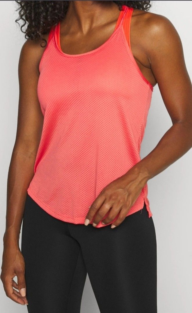 Nike Pink Workout Tank Top (Category: Activewear) located in Pasig City. Submitted by rachelleduarte_12272406 (Listing ID 1468977443, Image 3). Description: - Brand: Nike - Color: Bright pink - Material: Lightweight, breathable mesh - Design: Racerback with double criss-cross straps - Hem: Curved with a longer back - Logo: White Nike swoosh near the front hem - Ideal for: Workouts, running, and active lifestyle.