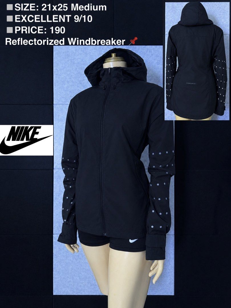 Nike Reflectorized Windbreaker Black Medium (Category: Coats, Jackets and Outerwear) located in San Rafael. Submitted by jules.ciao (Listing ID 1468947434, Image 1). Description: - Brand: Nike - Item: Black windbreaker jacket with hoodie - Condition: 9/10 (Excellent shape) - Size: Medium (21x25 inches) - Features: Reflector dots on sleeves and back, full zip closure up to the chin - Best for: Lightweight wind protection during runs and outdoor wo