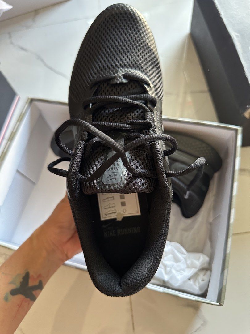 Nike Running Shoes Black (Category: Sneakers) located in Vinzons. Submitted by melodylarg85741 (Listing ID 1468978125, Image 2). Description: - Brand: Nike - Colorway: Triple Black - Condition: Brand new, unworn, pristine condition with spotless soles - Upper: Breathable mesh with supportive synthetic overlays - Outsole: Durable rubber with textured waffle tread pattern - Packaging: Comes in original Nike box with tissue paper - Best for: Daily t