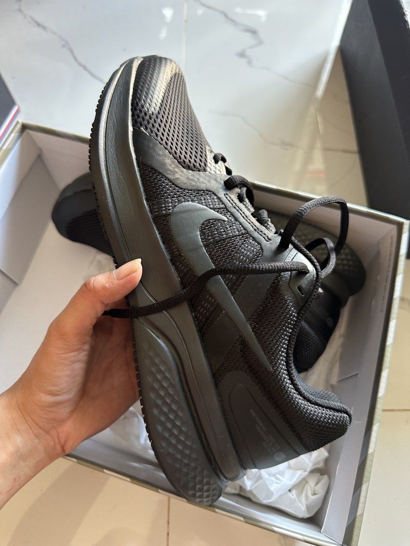 Nike Running Shoes Black (Category: Sneakers) located in Vinzons. Submitted by melodylarg85741 (Listing ID 1468978125, Image 3). Description: - Brand: Nike - Colorway: Triple Black - Condition: Brand new, unworn, pristine condition with spotless soles - Upper: Breathable mesh with supportive synthetic overlays - Outsole: Durable rubber with textured waffle tread pattern - Packaging: Comes in original Nike box with tissue paper - Best for: Daily t