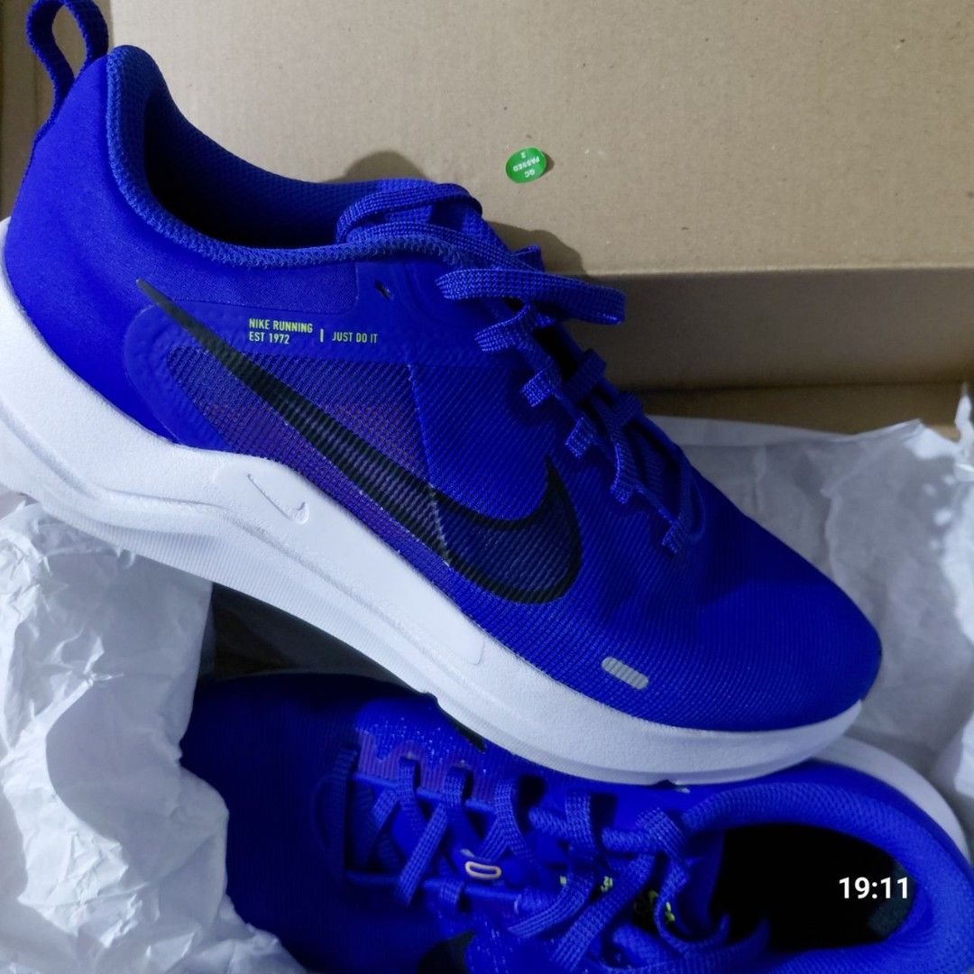 Nike Running Shoes Blue (Category: Sneakers) located in Manila. Submitted by thutpapichristtoffts036 (Listing ID 1468998840, Image 2). Description: - Brand: NIKE 💯 ORIGINAL - Type: Running shoes - Color: ROYAL/AZURE BLUE; Bright blue with white sole and black swoosh - Details: 'Nike Running Est 1972 Just Do It' text near the collar - Condition: BRAND NEW, Never worn outside, Very Good Condition (No Tag) - Inclusions: Comes with laces, Original t