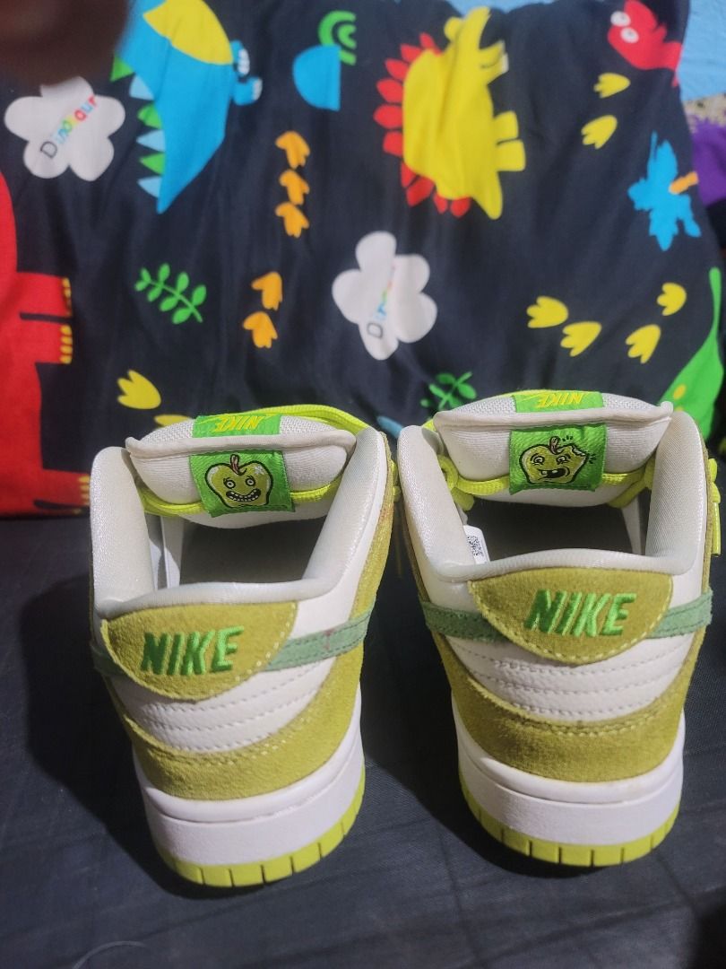 Nike SB Dunk Low Apple Green Size US 8 (Category: Sneakers) located in Caloocan City. Submitted by remwil18 (Listing ID 1468933403, Image 3). Description: - Model: Nike SB Dunk Low Apple Green - Size: US 8 / EUR 41 - Colorway: Green, white, and bright lime green - Materials: Suede and leather panels with Zoom Air cushioning - Special Feature: Cute apple graphic inside the tongue label - Condition: Minor red staining on the side panel of the left 