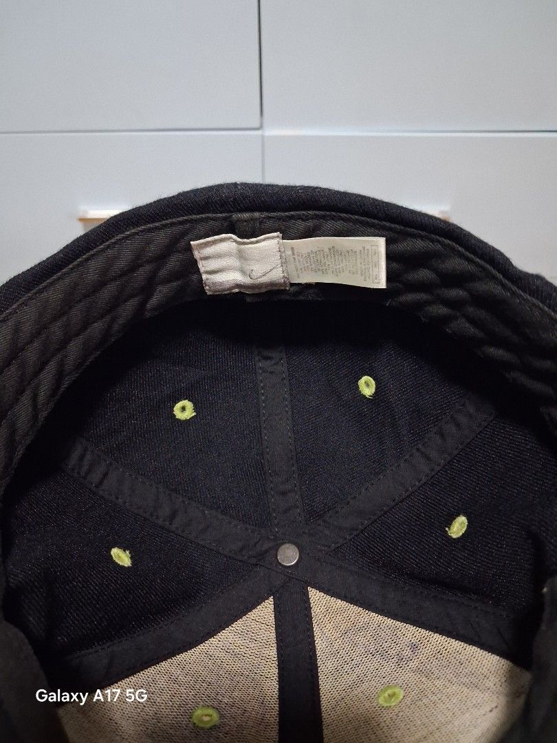 Nike Sky Is The Limit Black Cap (Category: Caps & Hats) located in Imus. Submitted by jefflac54673 (Listing ID 1468936382, Image 3). Description: - Brand: Nike vintage - Color: Black with yellow and red embroidery - Design: "Sky The Limit" text and small red swoosh on the front - Details: Unique green eyelets on the crown, standard curved brim - Fit: Adjustable back closure for all sizes - Condition: Clean structure, tag intact with wash instruct