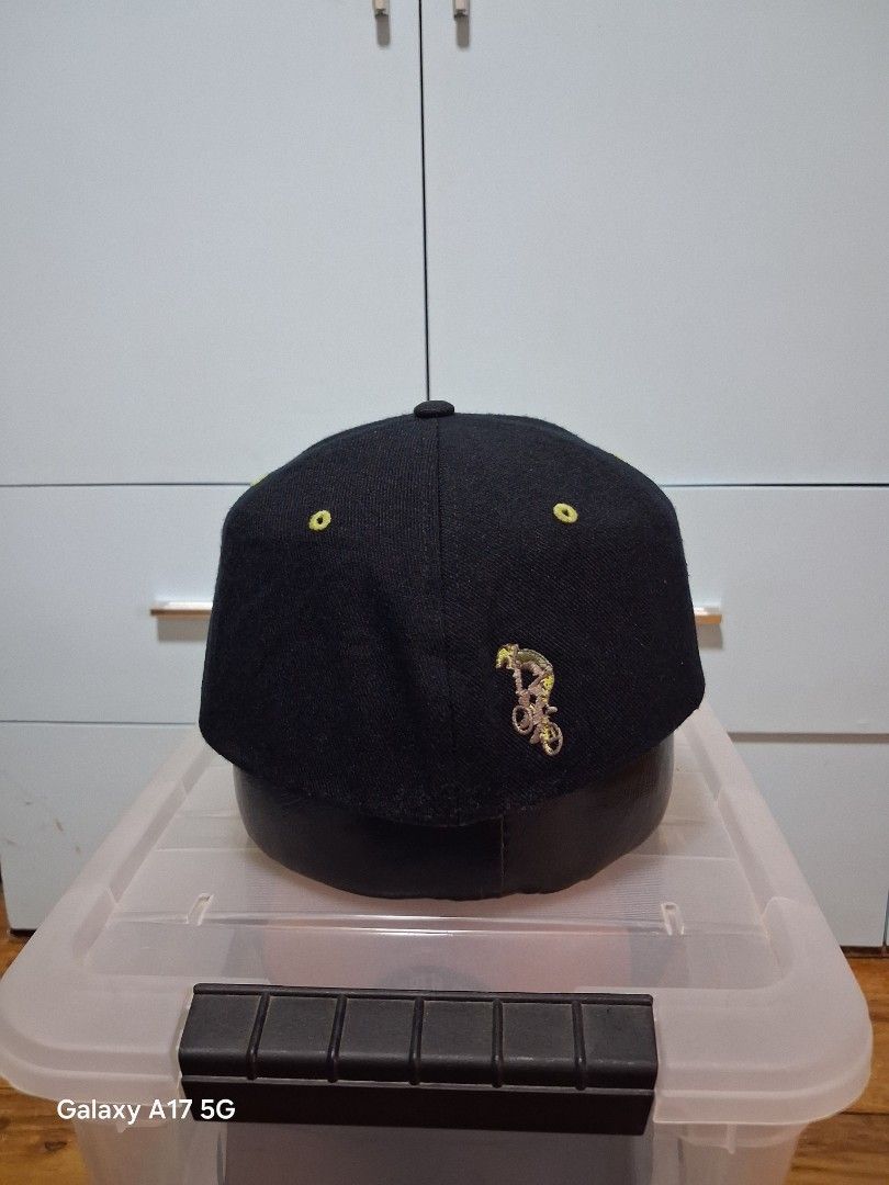 Nike Sky Is The Limit Black Cap (Category: Caps & Hats) located in Imus. Submitted by jefflac54673 (Listing ID 1468936382, Image 2). Description: - Brand: Nike vintage - Color: Black with yellow and red embroidery - Design: "Sky The Limit" text and small red swoosh on the front - Details: Unique green eyelets on the crown, standard curved brim - Fit: Adjustable back closure for all sizes - Condition: Clean structure, tag intact with wash instruct