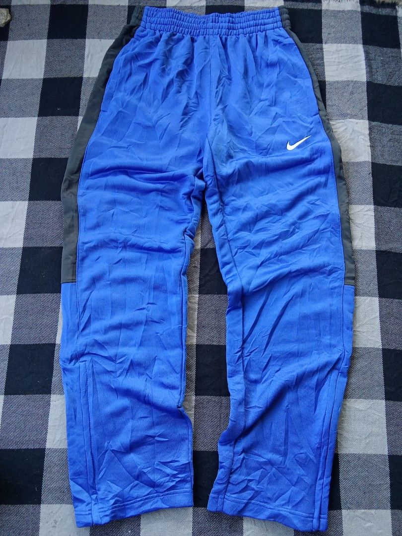 Nike Track Pants (Category: Activewear) located in Polomolok. Submitted by timog_high_ice (Listing ID 1468965256, Image 2). Description: - Blue/Black Color - Ankle zip - Jersy type - Waist 28-32 - Length 39.5 Maganda 🫶.