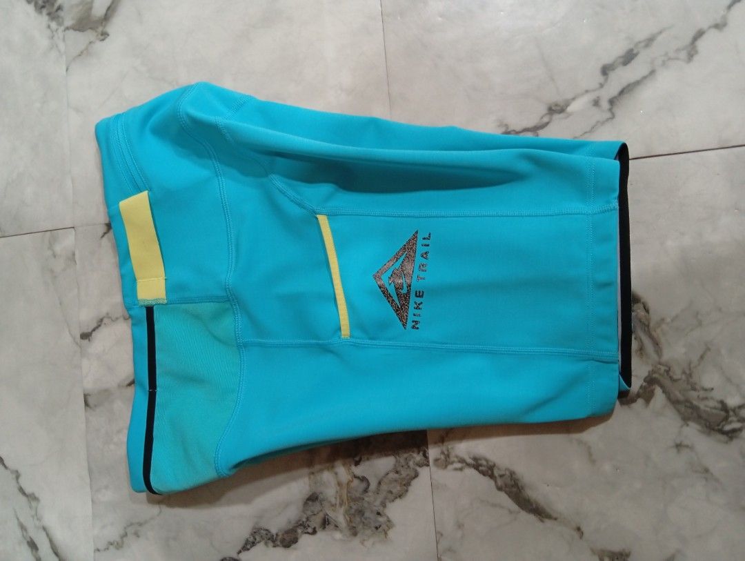 Nike Trail Blue Running Shorts with Pockets (Category: Activewear) located in Pasig City. Submitted by rachelleduarte_12272406 (Listing ID 1468943840, Image 3). Description: - Brand: Nike Trail - Color: Bright blue with contrasting yellow accents - Fit: High waist design - Pockets: Convenient drop-in side pockets and secure back zippered pocket - Material: Durable athletic fabric - Ideal For: Outdoor running and hiking.