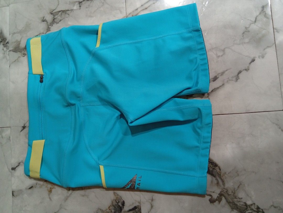 Nike Trail Blue Running Shorts with Pockets (Category: Activewear) located in Pasig City. Submitted by rachelleduarte_12272406 (Listing ID 1468943840, Image 2). Description: - Brand: Nike Trail - Color: Bright blue with contrasting yellow accents - Fit: High waist design - Pockets: Convenient drop-in side pockets and secure back zippered pocket - Material: Durable athletic fabric - Ideal For: Outdoor running and hiking.