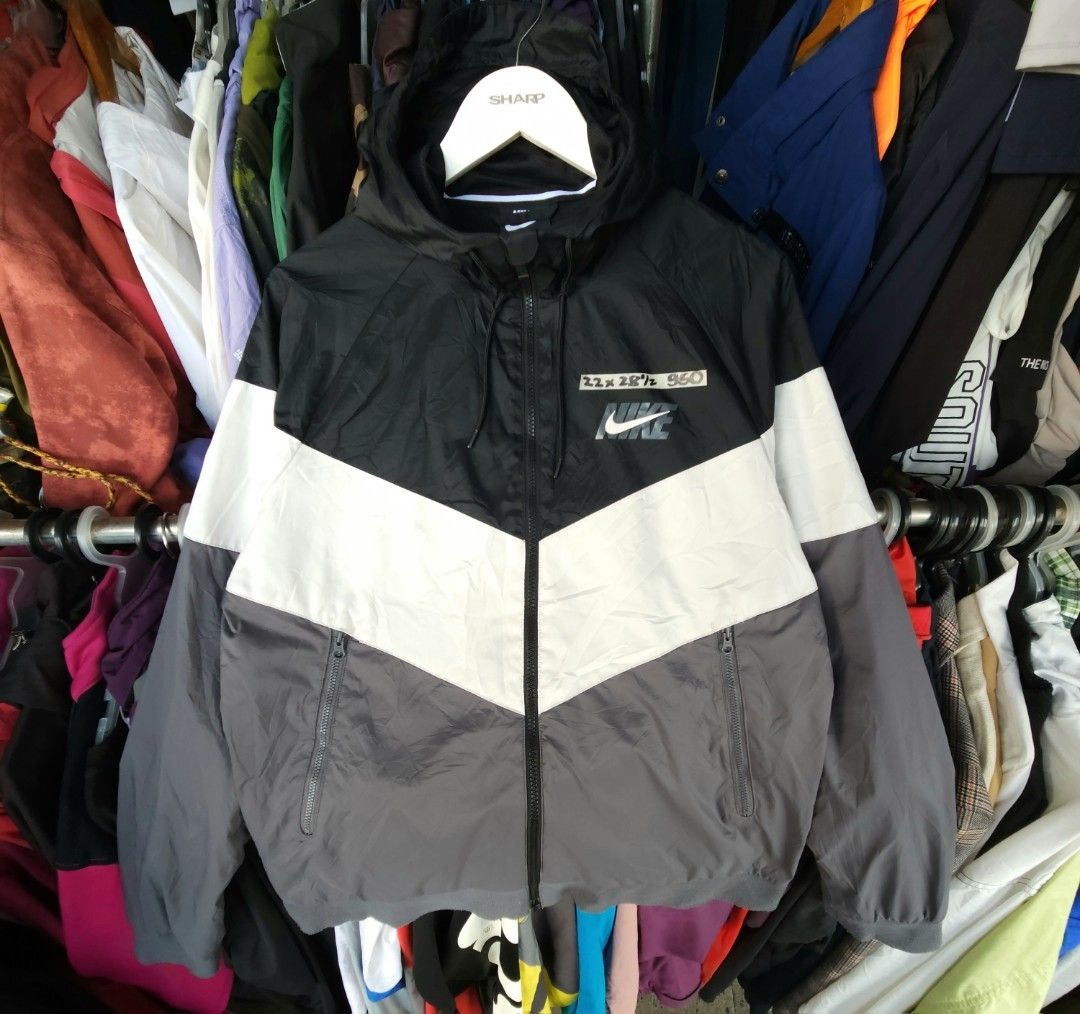 Nike tri color windbreaker with back hit logo (Category: Coats, Jackets and Outerwear) located in Davao. Submitted by edigromnic99538 (Listing ID 1468987397, Image 1). Description: nike tricolor white gray black windbreaker 22x28½ dimensions excellent condition ‼️LEGIT‼️ lightweight inne mesh 84 af.
