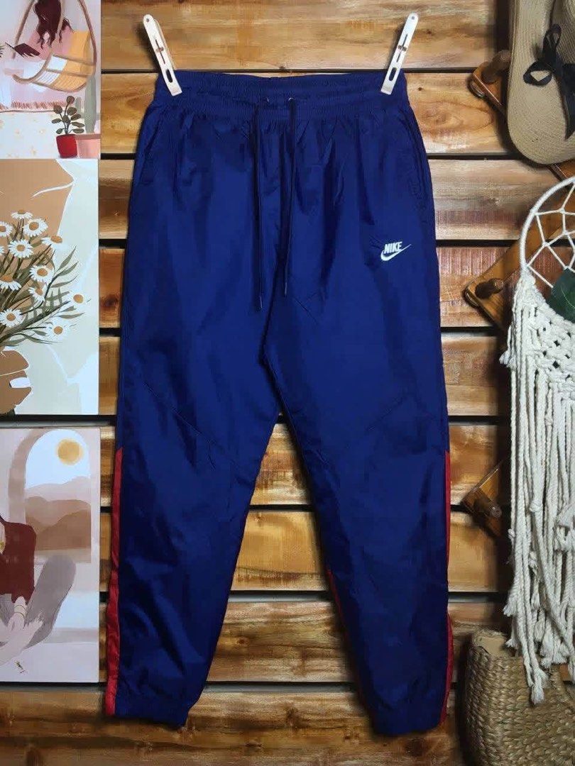 Nike Windrunner Nylon Track Pants (Category: Joggers) located in Pagadian. Submitted by angelcanzado (Listing ID 1468996424, Image 1). Description: Nike Windrunner Nylon Track Pants Excellent Condition Complete Tags Emboidered Logo Pockets both side Large on Tag Size: 31 - 34 Adjustable Drawstring garterize Length: 38 inches .