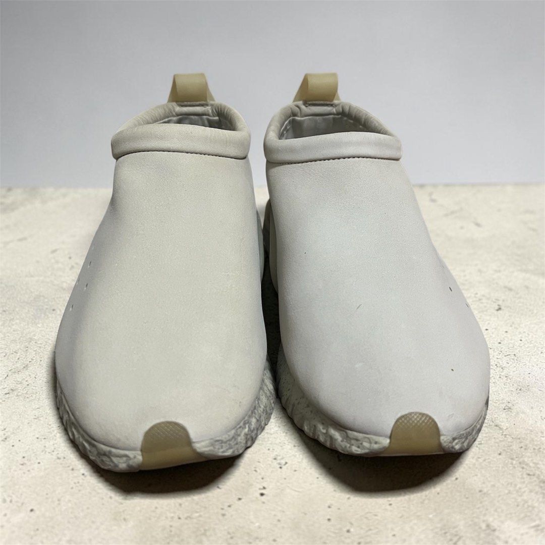 Nike x Undercover Jun Takahashi Moc Flow Light Bone (Category: Sneakers) located in Manila. Submitted by chococoffeeboy (Listing ID 1468969618, Image 3). Description: -Nike x Undercover Jun Takahashi Collaboration “Chaos & Balance” -Very hard to find! -Fresh pair! - Clean off-white leather suede upper - Signature 'CHAOS' and 'BALANCE' red text branding - Features: Speckled midsole, translucent heel clips, and back toggle lace system - Comfort: Sl