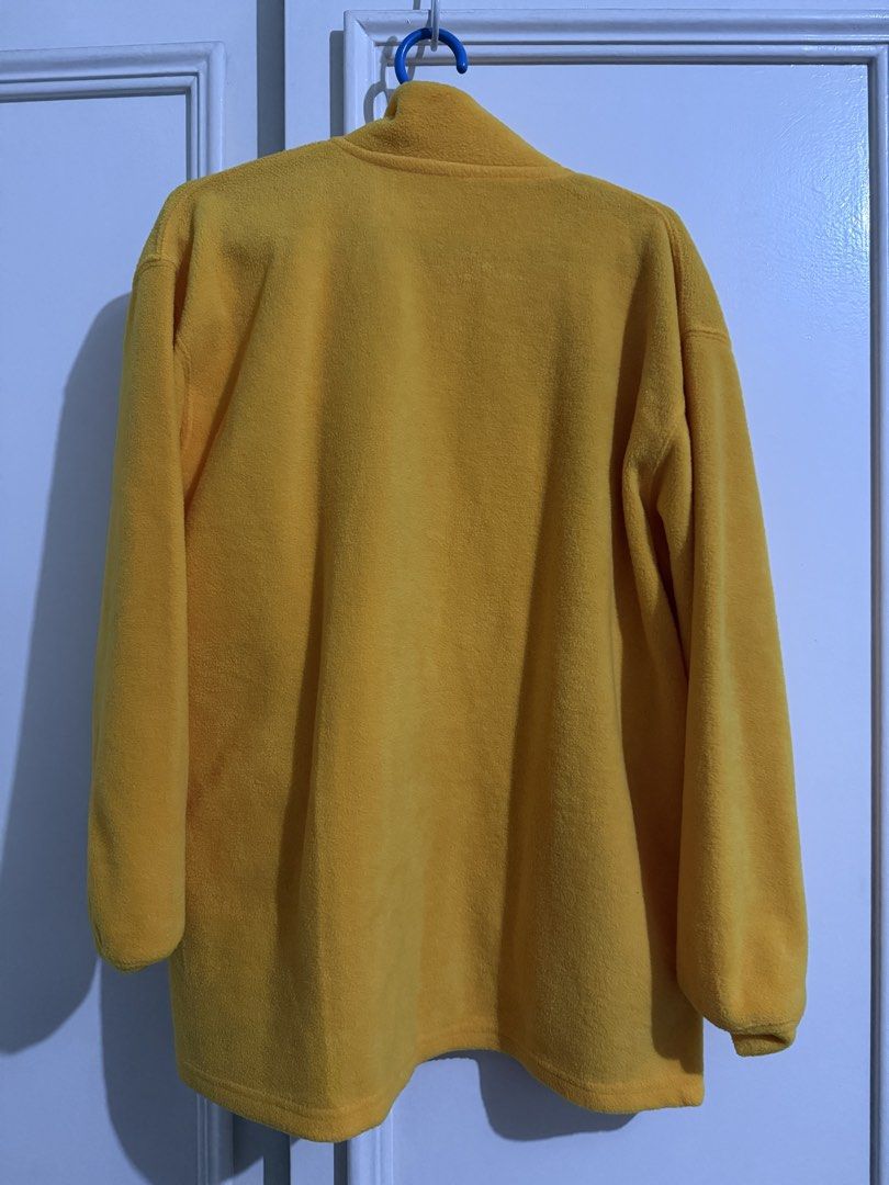Nike Yellow Fleece Zip-Up Jacket (Category: Coats, Jackets and Outerwear) located in Paranaque City. Submitted by pausauz (Listing ID 1469040492, Image 3). Description: - Brand: Nike - Color: Bright yellow with embroidered blue and red logo - Material: Soft fuzzy fleece, great for cooler weather - Features: High collar, full front zip, and two side pockets - Fit: Relaxed fit with long sleeves, ideal for layering Fits S-M.