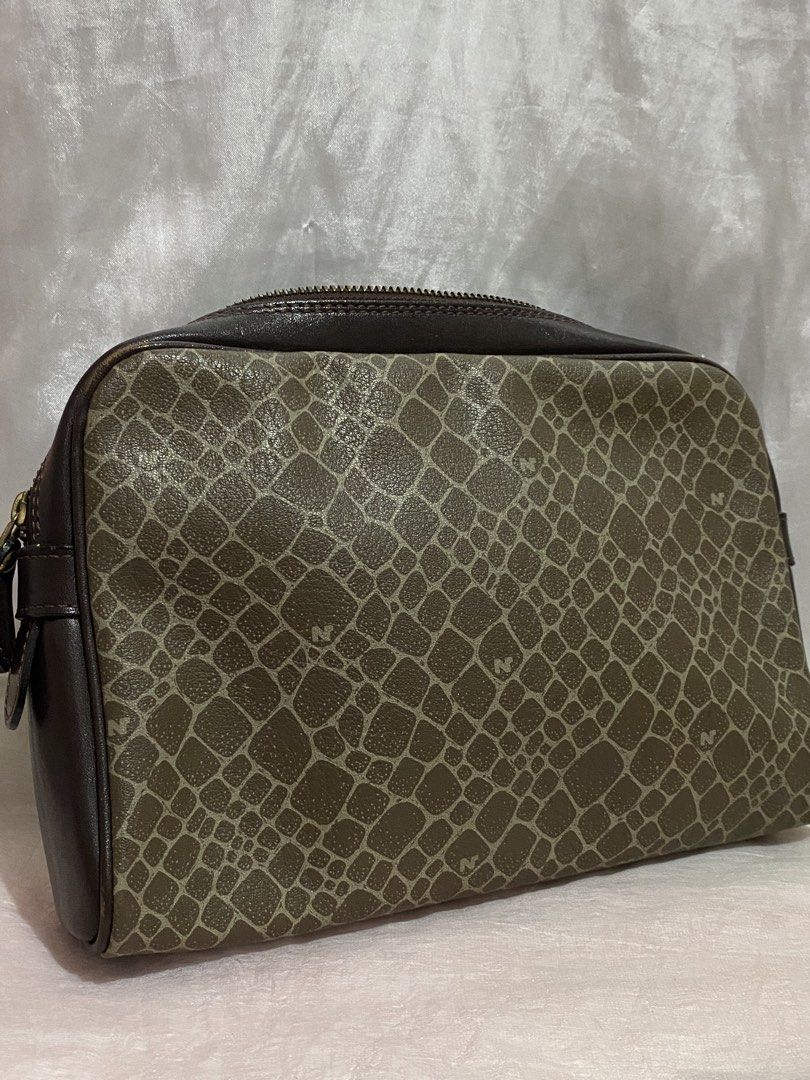 Nina Ricci cosmetic pouch (Category: Purses & Pouches) located in Taguig. Submitted by nekosan_ (Listing ID 1468979925, Image 2). Description: Good condition pa Declutter.