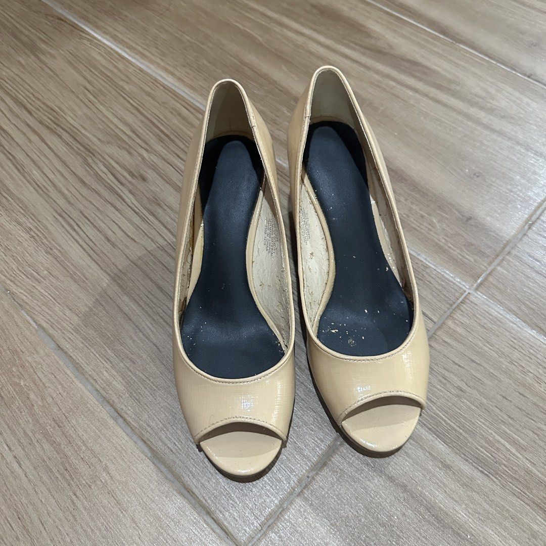 Nine West Nude Open Toe Wedge Heels (Category: Heels) located in Pasig City. Submitted by nina.declutter (Listing ID 1468991838, Image 3). Description: - Brand: Nine West - Style: Open toe slip-on wedge heels - Color: Classic nude patent - Size: 6.5M - Versatile neutral piece, great for workwear or casual outfits - Condition note: Heavy peeling and flaking on the interior lining, with minor wear on the soles.