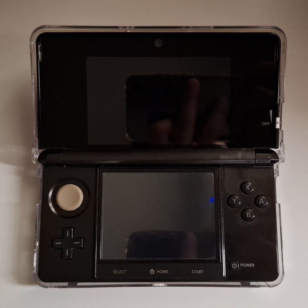 Nintendo 3DS (Black) (Category: Nintendo) located in Manila. Submitted by nofyr (Listing ID 1469051421, Image 2). Description: Selling my pre-loved Nintendo 3DS. In very good, functional condition. * Very good battery life * 3D slider, camera, WiFi, and volume working * CFW * Comes with FREE 32GB SD card, EVA hard pouch, 220V charger, clear shell, bottom screen protector Issues (see listing photos): * Cosmetic scratches on body * Missing screw on