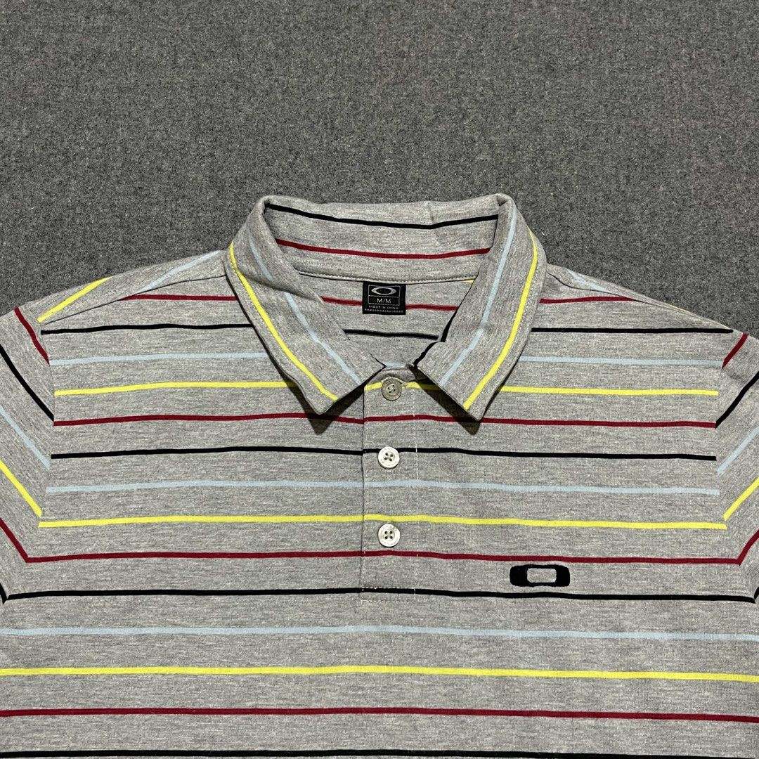 Oakley - Striped Polo Shirt (Medium) (Category: Tshirts & Polo Shirts ) located in Pasig City. Submitted by _rosasass_ (Listing ID 1469106791, Image 2). Description: Authntic Good as new Size medium Width 21 Length 27.