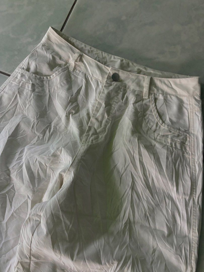 Off-white long shorts Unisex (Category: Shorts) located in Batangas. Submitted by jinventoryarchive (Listing ID 1469060191, Image 2). Description: Waist: 29 Length: 26 Leg Op: 13 Thigh: 13.5 - Color: Off-white (neutral shade that matches everything) - Style: Wide-leg, length with a structured fit - Details: Front button closure, belt loops, curved front pockets, and classic back pockets - Fit: Standard women's cut - Condition: Wrinkled from stora