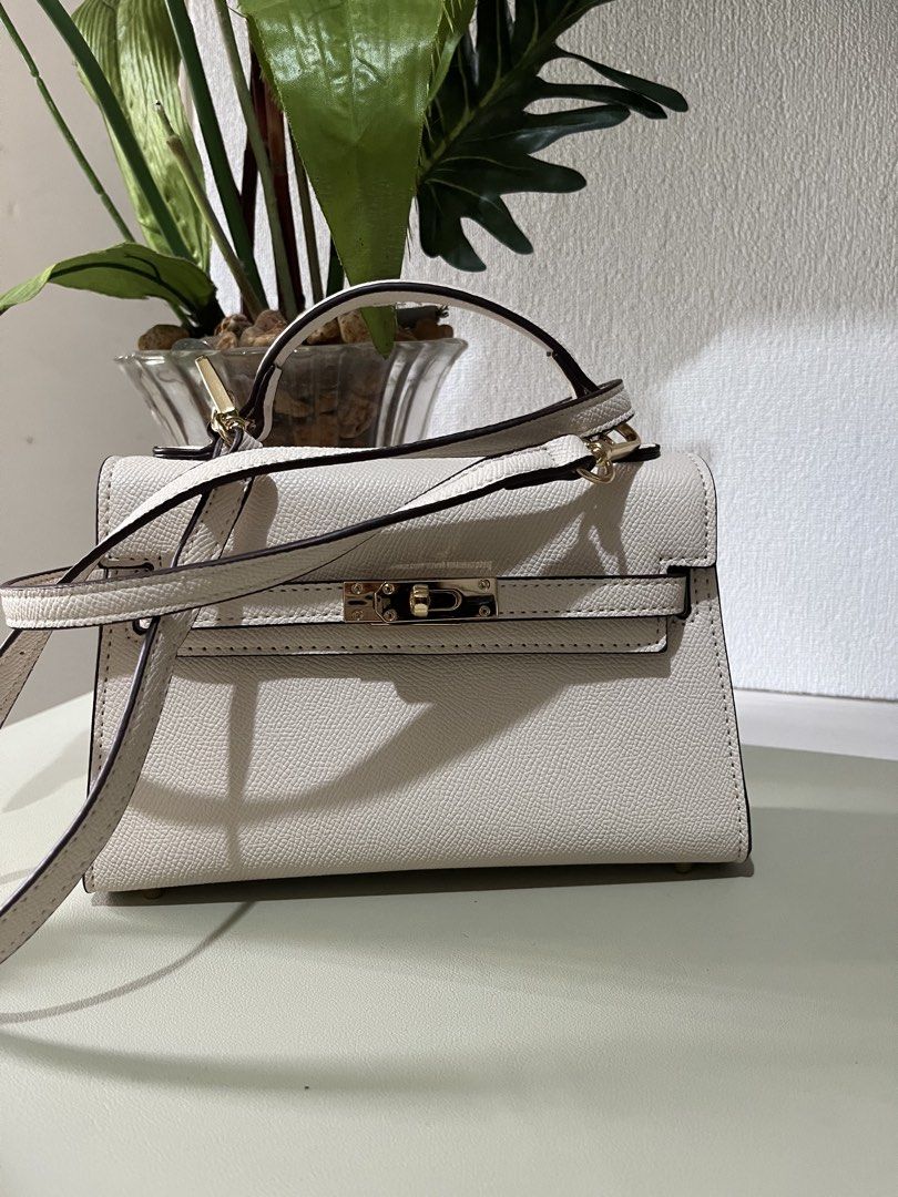 Off-White Structured Top Handle Bag with Gold Hardware (Category: Luxury Bags & Wallets) located in Quezon City. Submitted by eloveshopping.ph (Listing ID 1469046903, Image 2). Description: Off-white top handle bag with textured faux leather finish. Gold-tone hardware. Pristine condition, clean inside and out. Minor color transfer at the back (refer from last photo).