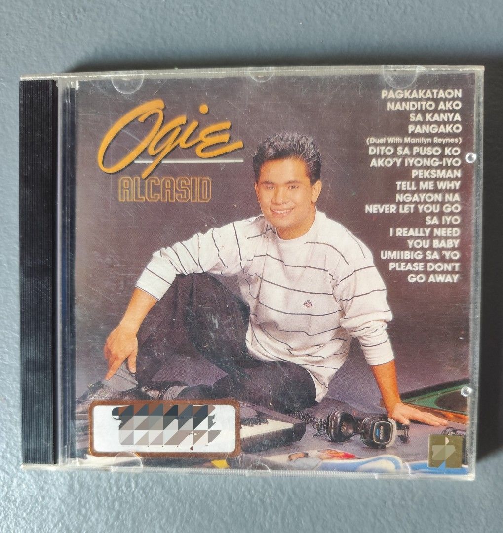Ogie Alcasid Audio CD Album (Category: CDs & DVDs) located in Valenzuela. Submitted by xjepsx (Listing ID 1468943451, Image 1). Description: - Classic Ogie Alcasid OPM music CD album - Features popular OPM hits listed on the cover art - Standard jewel case with minor surface scratches from storage - Original artwork insert and tracklist included and intact.