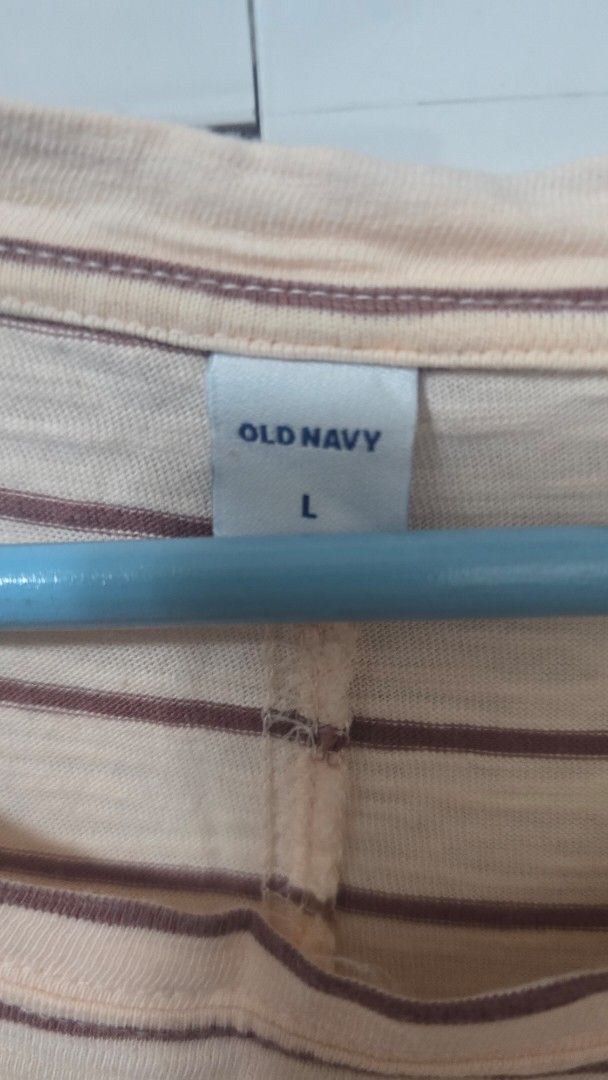Old Navy Striped Tank Top Size L (Category: Sleeveless) located in Cabanatuan. Submitted by belle_1013 (Listing ID 1469071441, Image 3). Description: - Brand: Old Navy - Item: Sleeveless tank top - Color: Beige with brown vertical stripes - Material: Soft ribbed fabric - Size: Large - Condition: Great casual piece, smoke-free home.