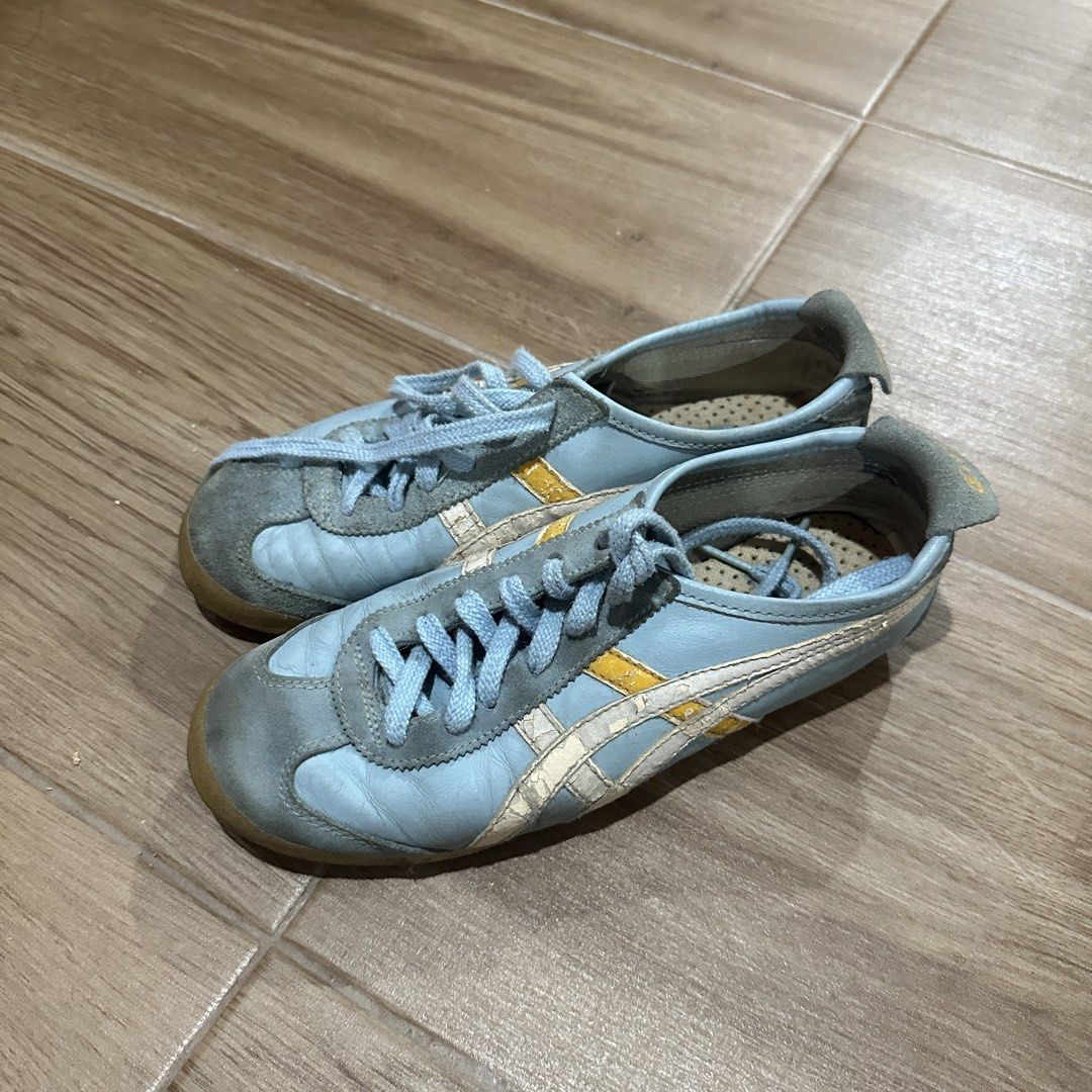 Onitsuka Tiger Mexico 66 Light Blue Yellow (Category: Sneakers) located in Pasig City. Submitted by nina.declutter (Listing ID 1469033634, Image 2). Description: - Authentic Onitsuka Tiger sneakers - Eye-catching light blue and yellow colorway - Classic low-top design with signature side stripes - Premium suede overlays at the toe and heel - Comes with matching light blue laces - Condition: Comfort-worn with sole wear and light cracking on the le