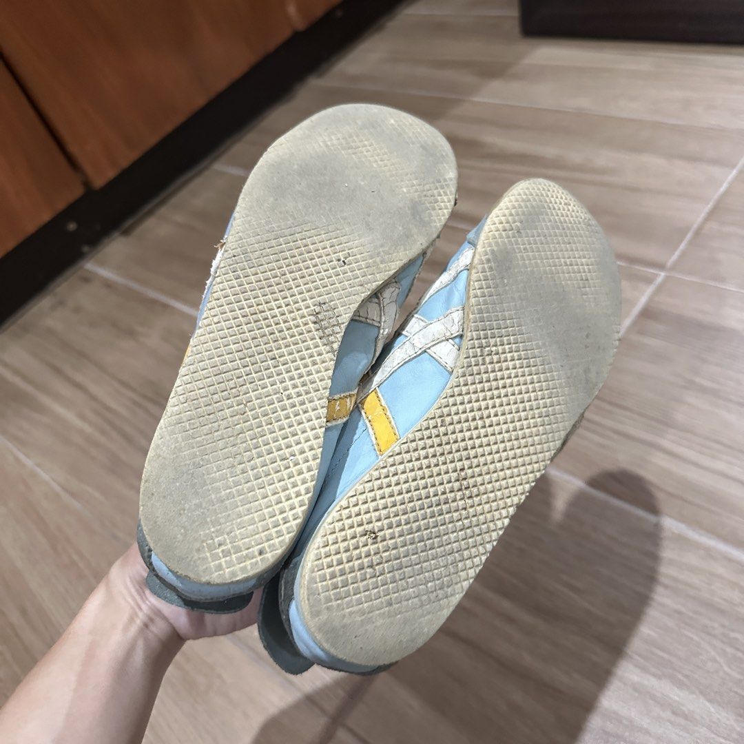 Onitsuka Tiger Mexico 66 Light Blue Yellow (Category: Sneakers) located in Pasig City. Submitted by nina.declutter (Listing ID 1469033634, Image 3). Description: - Authentic Onitsuka Tiger sneakers - Eye-catching light blue and yellow colorway - Classic low-top design with signature side stripes - Premium suede overlays at the toe and heel - Comes with matching light blue laces - Condition: Comfort-worn with sole wear and light cracking on the le