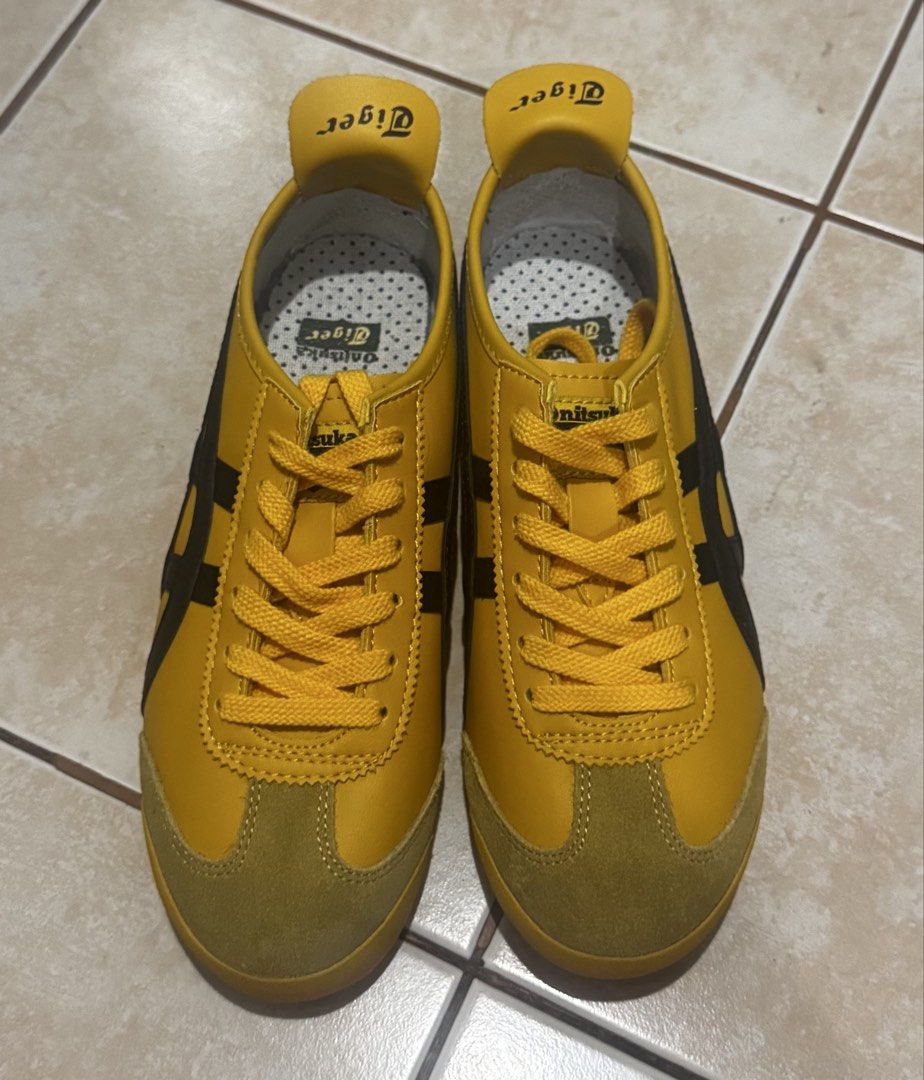 Onitsuka Tiger Yellow and Black Sneakers (Category: Sneakers) located in Manila. Submitted by prelovedgal22_ (Listing ID 1468973555, Image 1). Description: - Model: Onitsuka Tiger low-top sneakers Class A - Colorway: Bright yellow with black stripes and olive suede toe caps - Condition: Brand new / zero wear on uppers and soles - Details: Includes matching yellow laces, white insoles with black logo, and distinctive fold-over heel tab with brandi