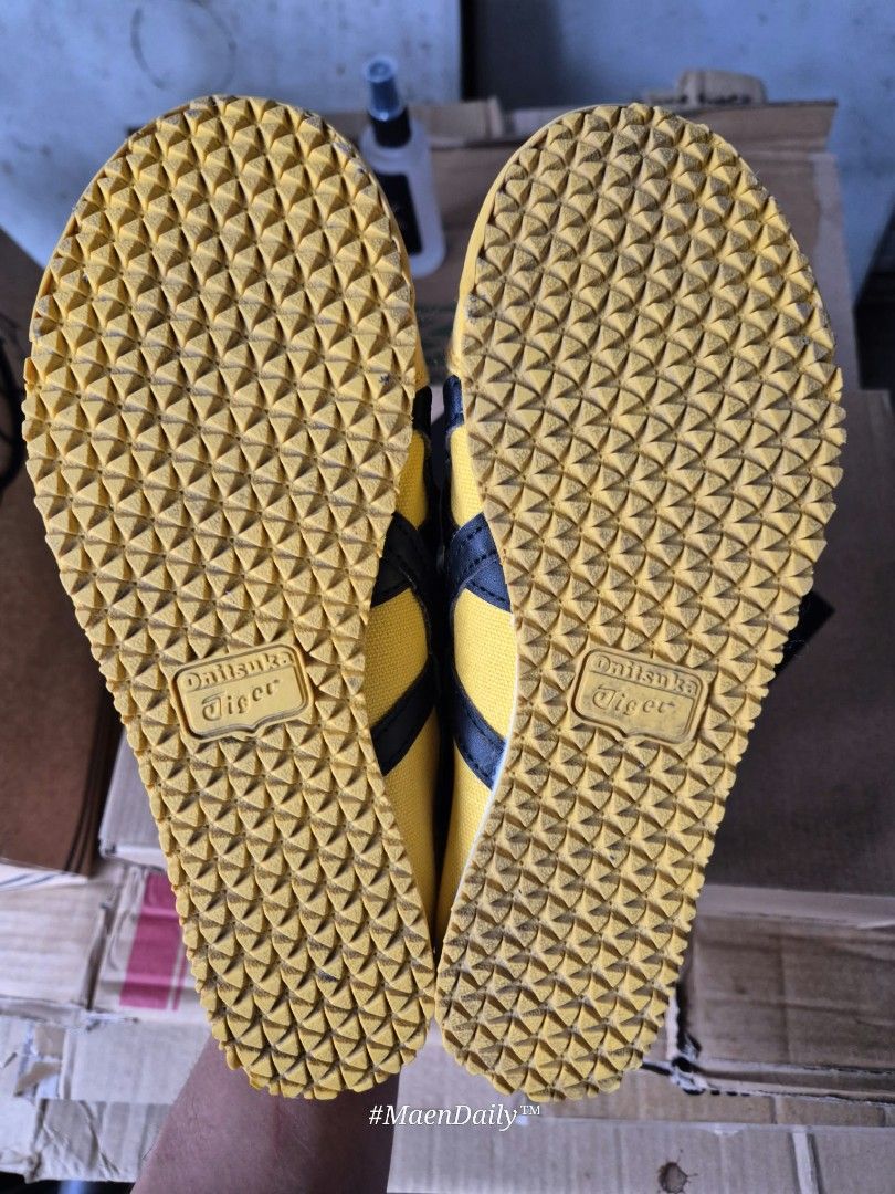 Onitsuka Tiger Yellow Black Sneakers (Category: Sneakers) located in Santo Tomas. Submitted by anneiyayey (Listing ID 1468980173, Image 3). Description: - Brand: Onitsuka Tiger - Style: Classic low-top slip-on sneakers (no laces) - Colorway: Striking yellow and black with signature side stripes - Soles: Yellow rubber outsoles with great tread grip remaining - Condition: Clean interior linings; minor normal wear and slight discoloration on suede t