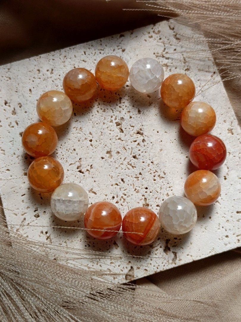 Orange Crackle Agate (Category: Bracelets) located in Manila. Submitted by enchantra_gems (Listing ID 1469044232, Image 1). Description: 🧡 ORANGE CRACKLE AGATE BRACELET Bold Orange • Statement Style • Enchantra Gemstones Make a statement with the vibrant beauty of Orange Crackle Agate. ✨ Featuring bold 14mm orange beads with distinctive crackle-like patterns, this bracelet brings a warm, eye-catching touch to your everyday style. Perfect for tho