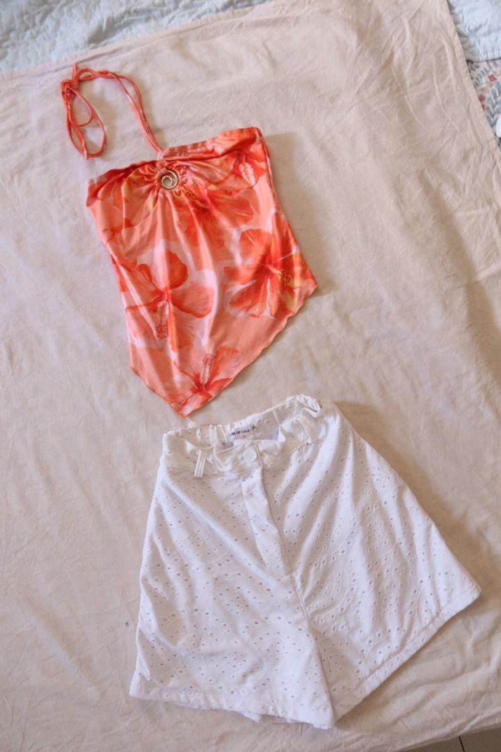 Orange Floral Halter Top Asymmetrical Hem O-Ring (Category: Sleeveless) located in Manila. Submitted by imama23 (Listing ID 1468347616, Image 1). Description: - Color/Pattern: Bright orange with red hibiscus floral print - Material: Lightweight and stretchy for a comfortable fit - Condition: Excellent, worn only once Size: XS-S Location: Manila 📦 SHIPPING • Full payment before shipping • NCR: J&T (1–3 days) / Grab or Lalamove (same-day) • Provin