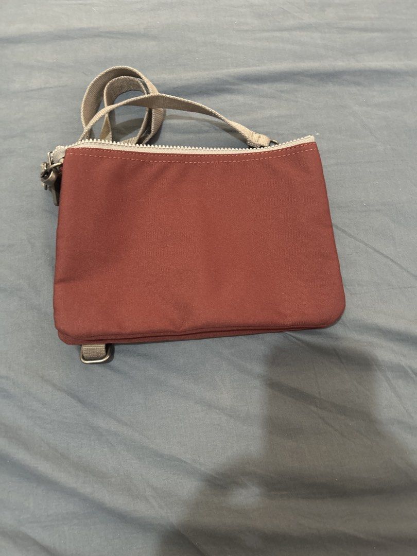 ORI London Multi-Compartment Crossbody Bag (Category: Cross-body Bags) located in Las Pinas. Submitted by mollysan1 (Listing ID 1468933874, Image 2). Description: - Brand: ORI London - Color: Maroon canvas with an adjustable grey strap - Storage: Multiple zipped compartments and slip pockets for phone, keys, and cards - Condition: Clean interior lining and smooth-running zippers - Ideal for: Daily errands, casual outings, and travel - MOP: GCash 