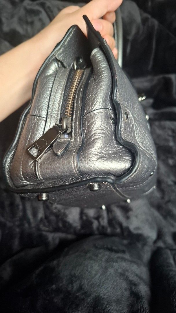 Original Coach Mercer Small size (Category: Luxury Bags & Wallets) located in Pasay City. Submitted by kgemsluxuryboutique (Listing ID 1468993439, Image 3). Description: - Brand: Coach - Material: Metallic silver textured leather - Hardware: Dark gunmetal - Closure: Front turnlock strap - 100% cowhide genuine leather ang ganda - Handles: Double top handles - Details: Embossed Coach logo stamp, (decorative red bead and black heart charm not includ