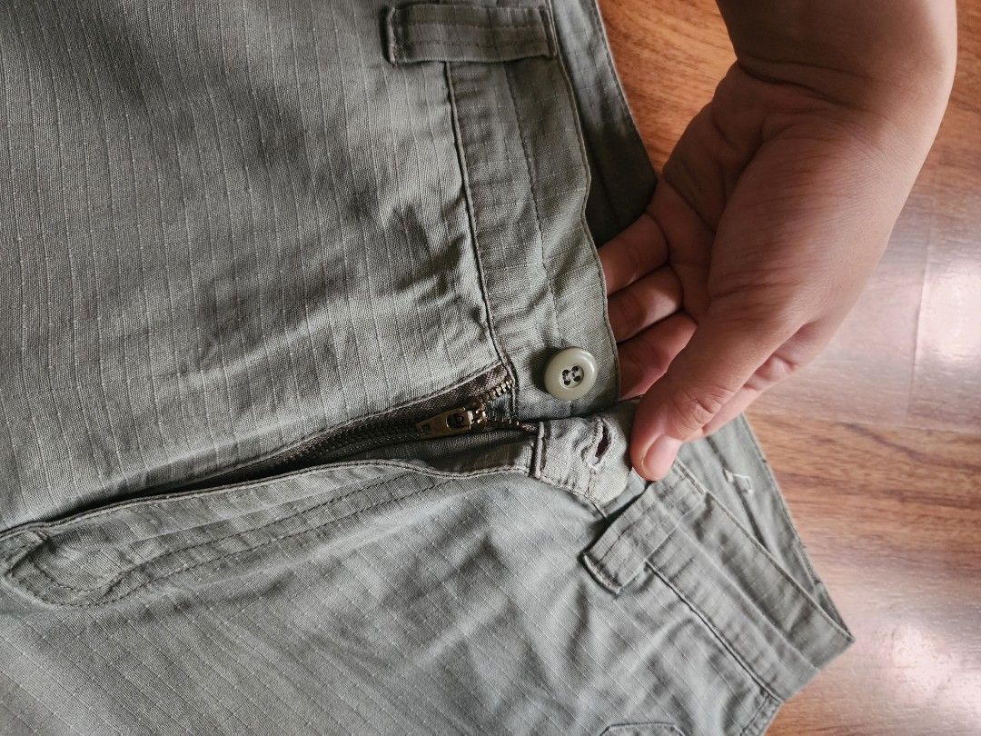 Outdoors Sage Green Cargo Shorts with Drawstring Cuffs (Category: Shorts) located in Pasig City. Submitted by mhiroel (Listing ID 1468963834, Image 2). Description: - Color: Trendy sage green - Fabric: Textured pattern throughout for extra style - Closure: Secure zipper fly with button - Pockets: Handy side and back pockets - Fit: Adjustable drawstring hems for a custom fit - Ideal for: Casual everyday wear, weekends, and outdoor activities.