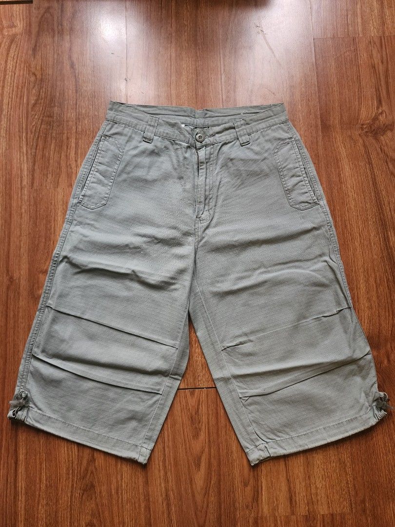 Outdoors Sage Green Cargo Shorts with Drawstring Cuffs (Category: Shorts) located in Pasig City. Submitted by mhiroel (Listing ID 1468963834, Image 1). Description: - Color: Trendy sage green - Fabric: Textured pattern throughout for extra style - Closure: Secure zipper fly with button - Pockets: Handy side and back pockets - Fit: Adjustable drawstring hems for a custom fit - Ideal for: Casual everyday wear, weekends, and outdoor activities.