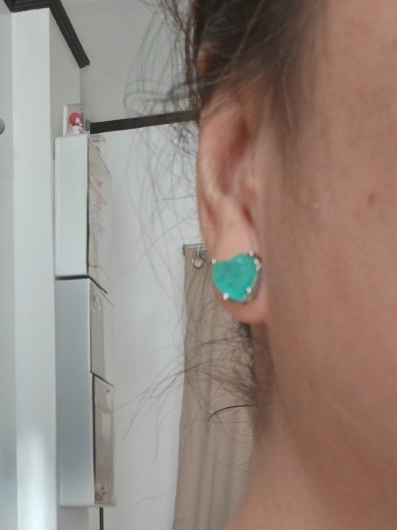 Paraiba heart shaped Stud Earrings with Silver Setting (Category: Earrings) located in Quezon City. Submitted by destashingme (Listing ID 1468951365, Image 3). Description: - Design: Heart-shaped turquoise stud earrings with natural stone texture - Color: Bright aqua green - Details: Metal setting with secure prong settings and butterfly backs - Condition: Clean backs and posts - Versatility: Great for daily wear or special occasions - Size: Comp