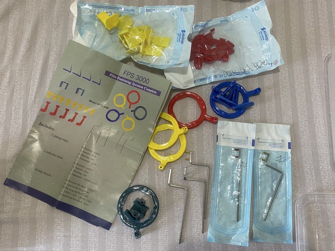 Periapical Xray Paralleling Device Autoclavable (Category: Medical Supplies & Tools) located in Quezon City. Submitted by trishopper (Listing ID 1469161451, Image 1). Description: - Complete dental x-ray film positioning system - Includes aiming rings, indicator arms, bite blocks, and manual chart - Color-coded components (yellow, red, blue, green) for easy organization Binili sa my first dental shop val .