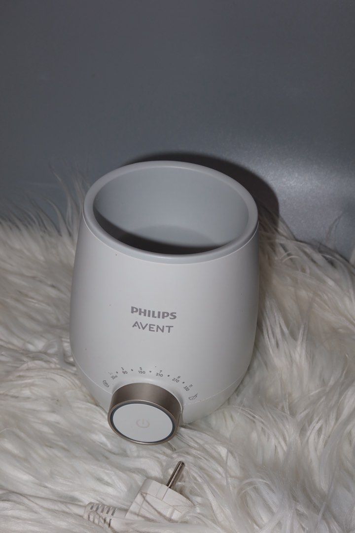 Philips Avent Fast Bottle Warmer (Category: Breastfeeding & Bottle Feeding) located in General Trias. Submitted by laiyieeeee (Listing ID 1469011458, Image 2). Description: - Authentic Philips Avent bottle warmer in clean white with a chic metallic gold control dial - Clear volume guide markings ranging from 30ml up to 330ml around the knob - Heats up milk bottles quickly, safely, and evenly - Includes original power cord with plug - Excellent wo